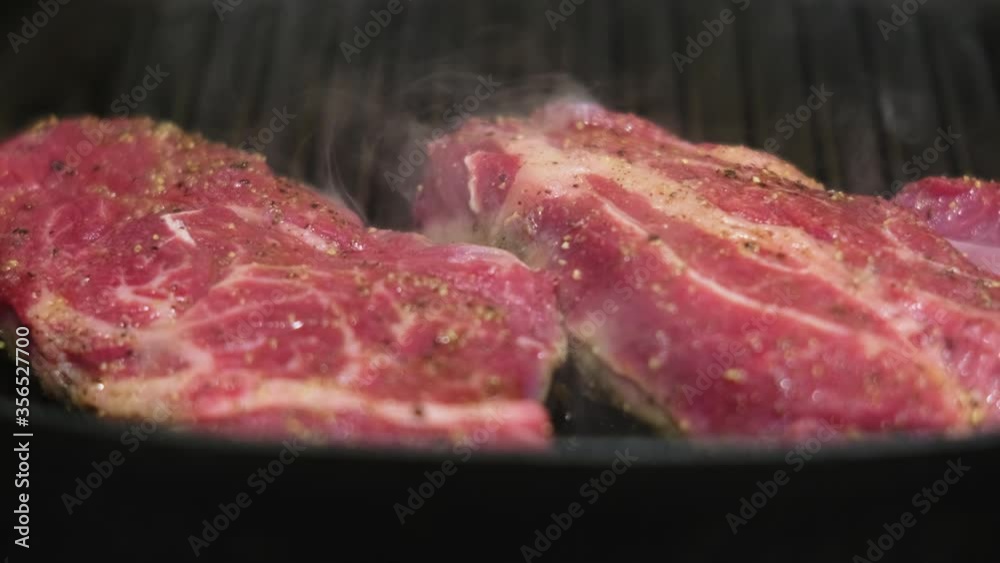 Grilled steaks in pan
