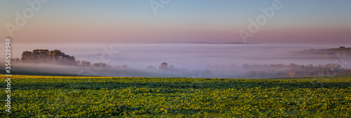 Early foggy panorama morning view in Moravian Tuscany in Czech republic.