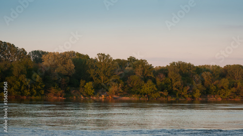 Obraz na płótnie fine view by the water by the setting sun in the Vistula valley w salonie