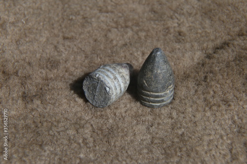 Valokuvatapetti antique lead bullet for a gun