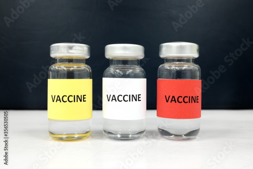 Multiple colors vaccine vials. Choices for coronavirus covid-19 vaccine concept.