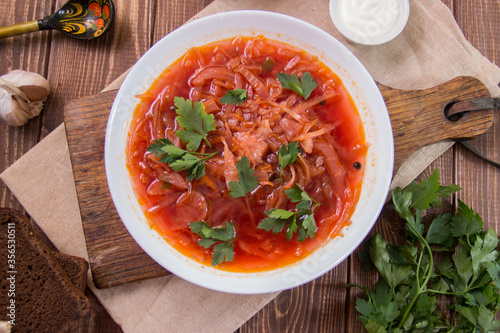 photo for menu, Ukrainian and Russian traditional beetroot soup - borscht with sour cream garlic pepper and sauce, Ukrainian borscht with sour cream, food background, Food and health