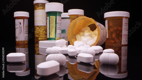 Prescription drugs and opioids on table top viewing up close.