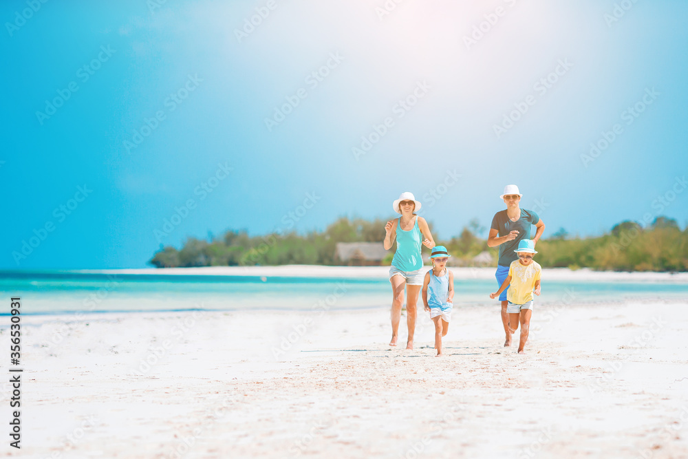 Photo of happy family having fun on the beach. Summer Lifestyle