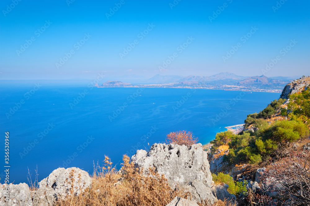 Romantic island of Sicily, wonderful view of seaside from high up, aerial view of blue Mediterranean sea with horizon over water in mist.. Sicily, Italy landscape.