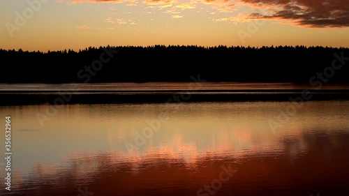 Crimson dawn on the lake.Colorful morning.Russia