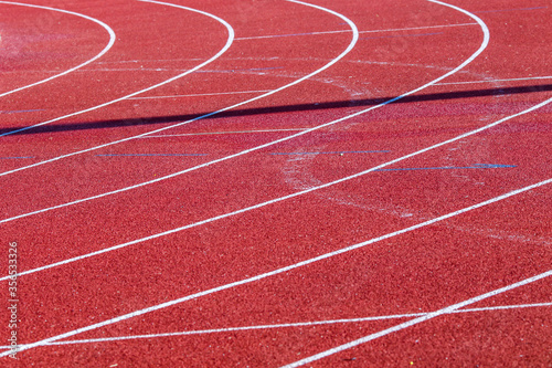 Red running sport track background and texture. Sport running track concept.