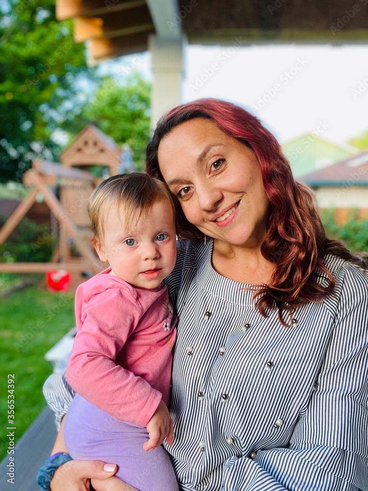 Close up Portrait, selfie of Beautiful Young Mother and adorable baby girl with big blue Eyes, Happy Family Concept Close up Portrait, selfie of Beautiful Young Mother and adorable baby girl with big blue Eyes, Happy Family Concept