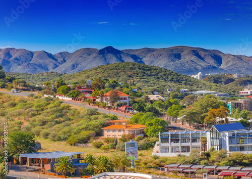 Skyline of Namibia's capital Windhoek with a cloudy sky photo