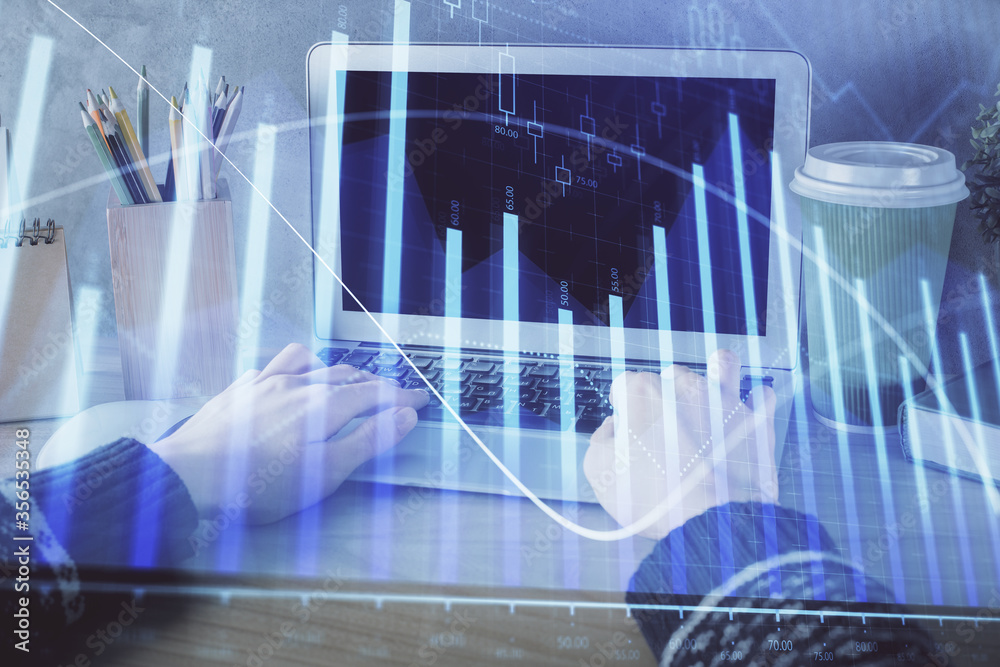 Double exposure of woman hands typing on computer and forex chart hologram drawing. Stock market invest concept. Double exposure of woman hands typing on computer and forex chart hologram drawing. Stock market invest concept.