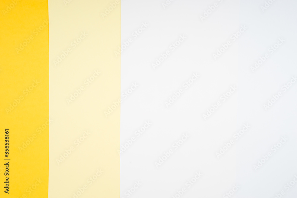 Creative arrangement of soft pastel colored papers creating an abstract background