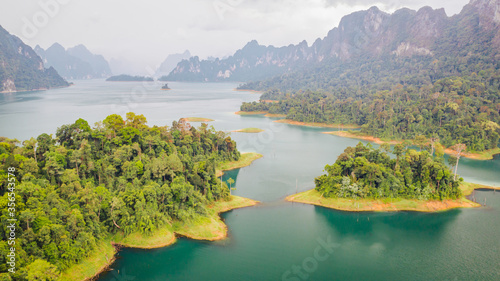 Aerial view of islands and limestone karst cliffs around Cheow Lan Lake in Khao Sok National Park, southern Thailand