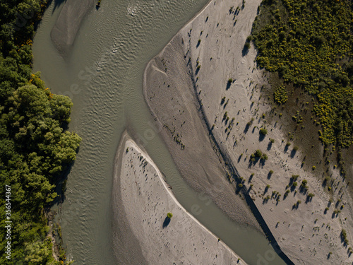 Aerial photos around Arthurs Point in Queenstown, New Zealand taken in the morning before the summer season with views of the shotover river, Coronet's peak, Queenstown hill and Bowen Peak. photo