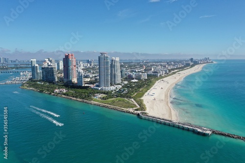 Aerial view of South Pointe Park and South Beach in Miami Beach, Florida with Port Miami and City of Miami skyline in background. © Francisco
