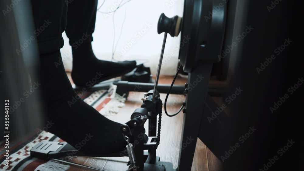 Young male drummer playing electronic drum kit at home. Rock music performance. Percussion instruments lesson in 60 fps can be in slow motion