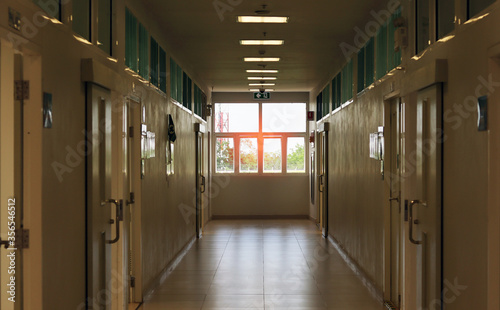 The corridor wallkway in the laboratory building.  walk through survey for safety checking, can use as a background interior field or building part background. Area way can walking. has sunlight.