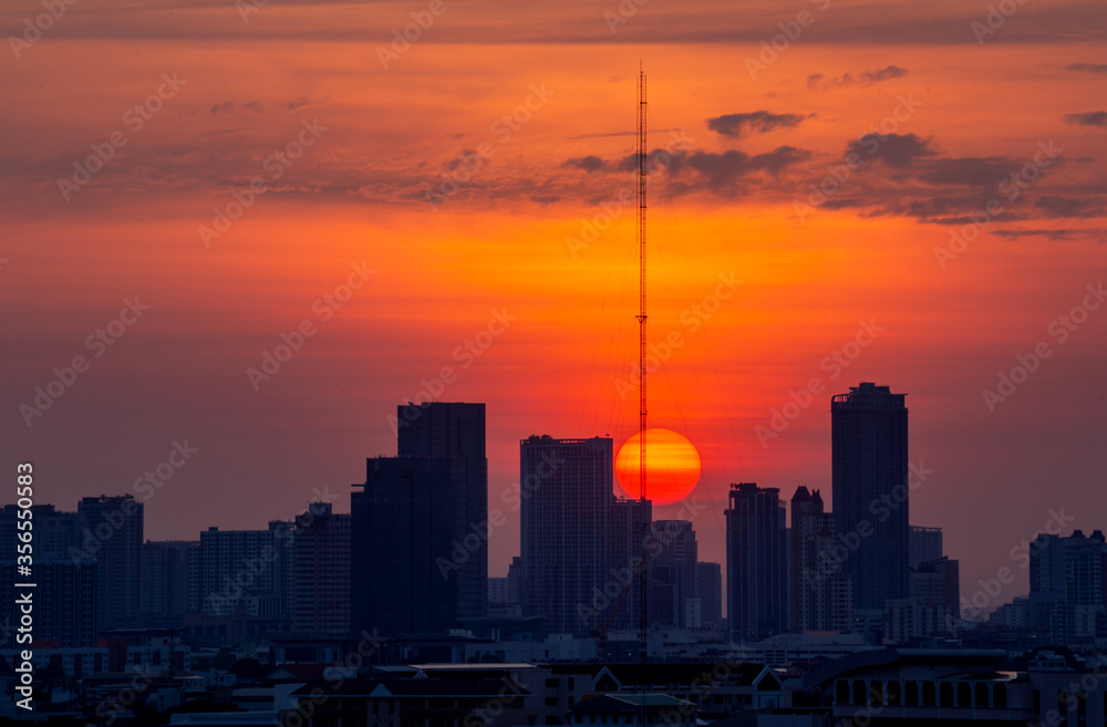 Sunrise in the city. Silhouette of buildings.