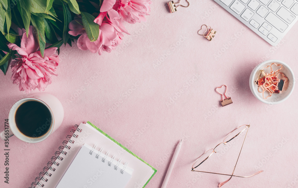 Office feminine desk workspace with pink peony, keyboard, cup of coffee, cosmetics, glasses, lipstick, empty notebook on white background. Office feminine desk workspace with pink peony, keyboard, cup of coffee, cosmetics, glasses, lipstick, empty notebook on white background.