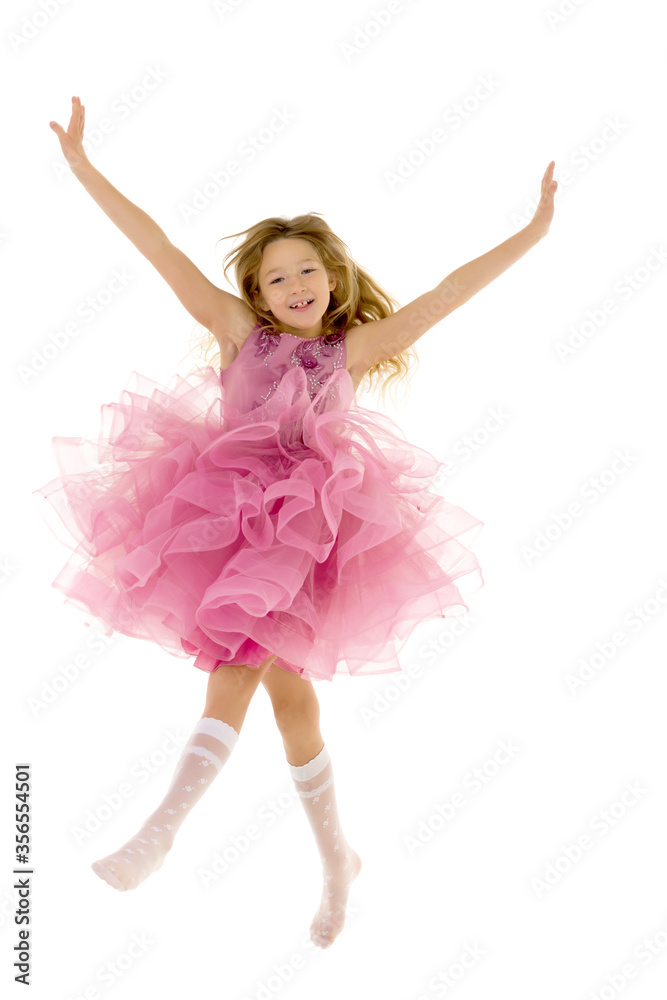 The little girl is jumping fun.The concept of a good mood, summer vacation. The little girl is jumping fun.The concept of a good mood, summer vacation.