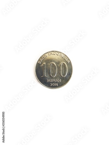 100 indonesian rupiah coin on soft white background. a coin from the republic of indonesia