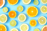 Collection of fresh lime, lemon, orange, citrus, grapefruit slice on blue background.