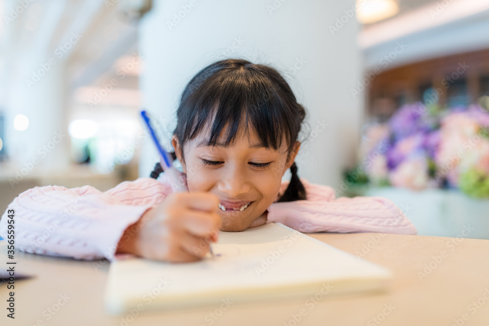 Kid girl draw on book Kid girl draw on book
