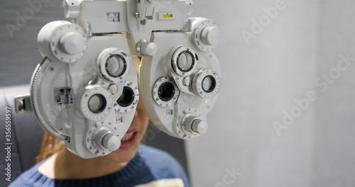 Woman check her eye at beauty salon