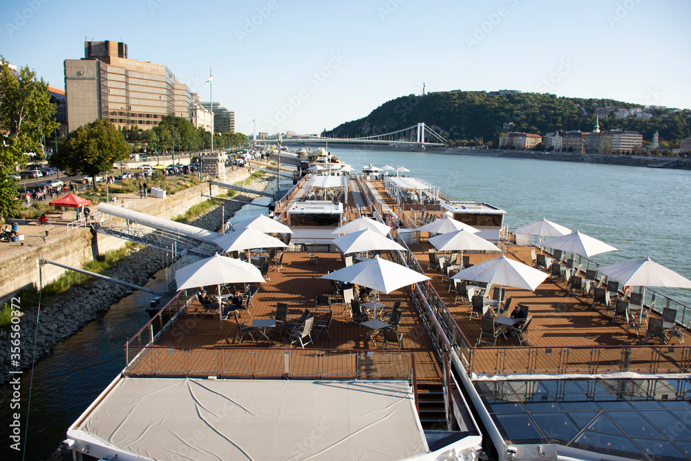 Modern cafe restaurant on cruise for Hungarian people and foreign traveler use service drink eat at riverside Danube river on September 22, 2019 in Budapest, Hungary