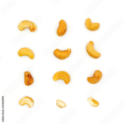 Roasted salted cashew nuts top view isolated on white background