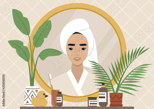 A mirror reflection, a Young female character wearing a towel wrapped at the side of their head, daily body care routine, boho interior, natural patterns and plants