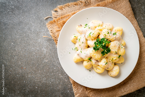 Gnocchi with mushroom cream sauce and cheese photo