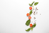 Composition with basil, tomatoes and spices on white background