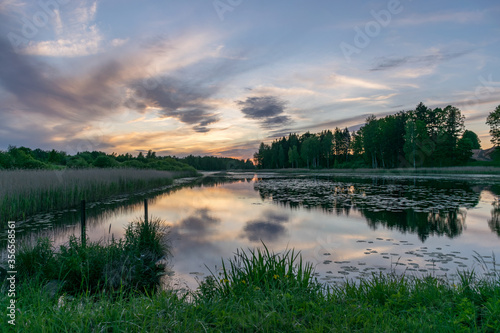 picture with beautiful colorful sunset over the lake, a wonderful place of strength and energy, peace, harmony and quiet