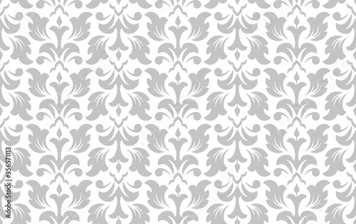Wallpaper in the style of Baroque. Seamless vector background. White and grey floral ornament. Graphic pattern for fabric, wallpaper, packaging. Ornate Damask flower ornament.