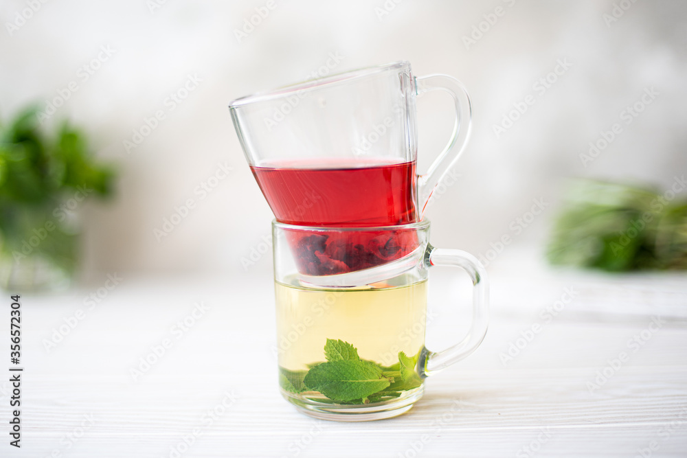 herbal tea and hibiscus tea in glass mugs herbal tea and hibiscus tea in glass mugs