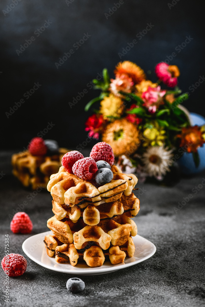 Belgian or french waffles for breakfast. Beautiful serve waffer cake with berries