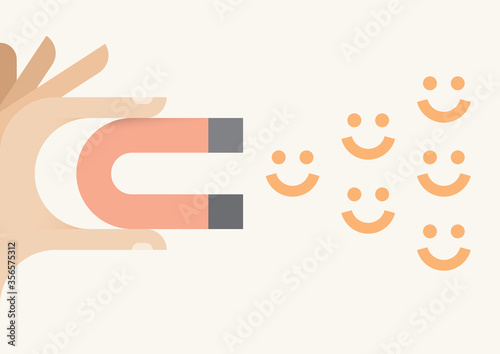 Human hand holding abstract magnet attracting smiles. Happiness and avoiding negativity, charisma concept.