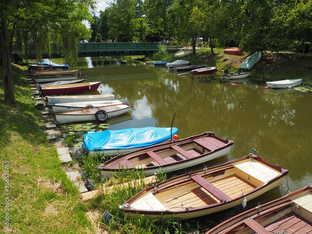 Obraz premium Balatonmáriafürdő, Hungary - June 06, 2020: Boats in a canal on the south side of Lake Balaton