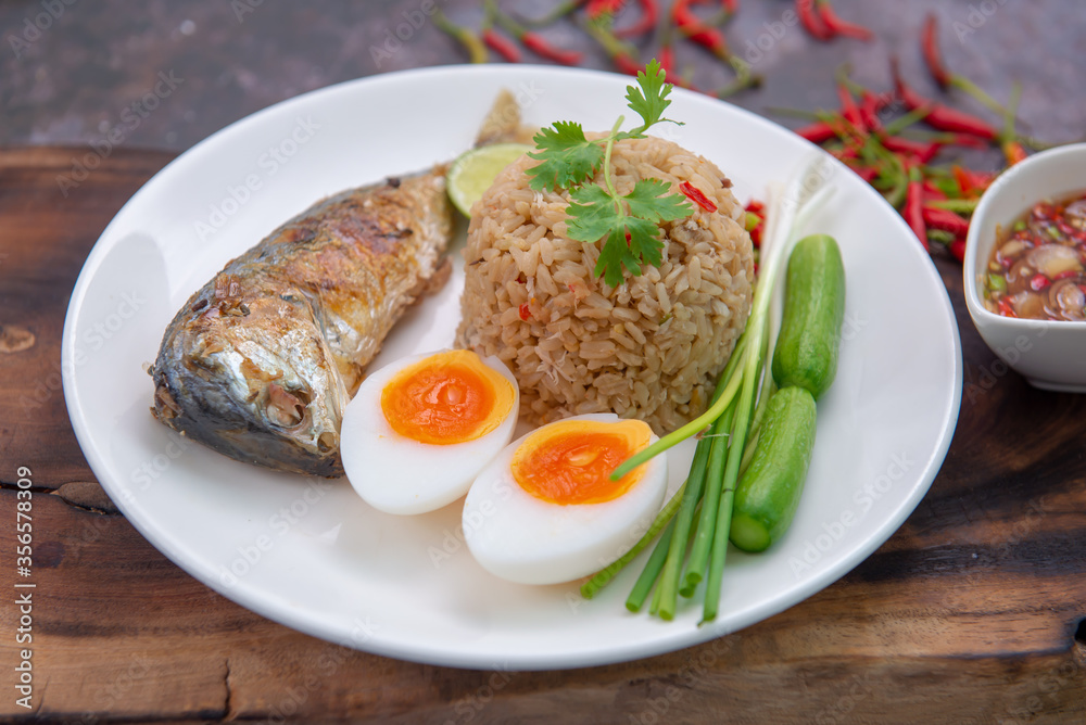 Thai food, Fried brown rice with Thai Mackerel chili Paste with. Served with Mackerel, Boiled eggs, Cucumber, and Lime, healthy food Thai food, Fried brown rice with Thai Mackerel chili Paste with. Served with Mackerel, Boiled eggs, Cucumber, and Lime, healthy food