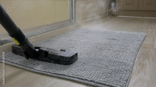 Wallpaper Mural 4k motorized dolly shot of cleaning bathroom mat using steam cleaner Torontodigital.ca