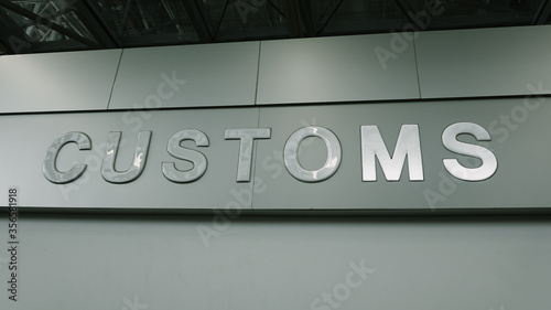 Airport customs declare sign on the wall at international terminal. Customs declare for import and export concept