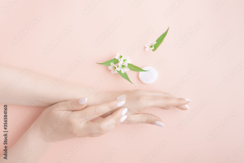 Woman moisturizing her hand with cosmetic cream, concept natural cosmetics, beauty spa scincare concept