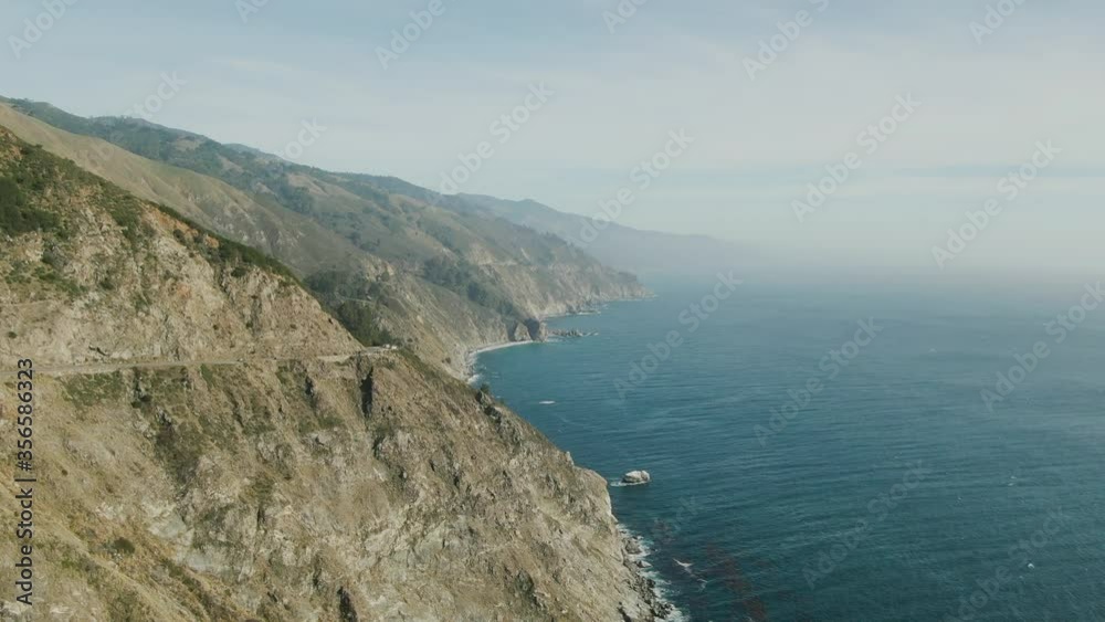 Natural drone flying over big sur California coast beautiful views overlooking the ocean sunset clouds sky sun sunny waves crashing environment travel view scene peak weather waves Natural drone flying over big sur California coast beautiful views overlooking the ocean sunset clouds sky sun sunny waves crashing environment travel view scene peak weather waves