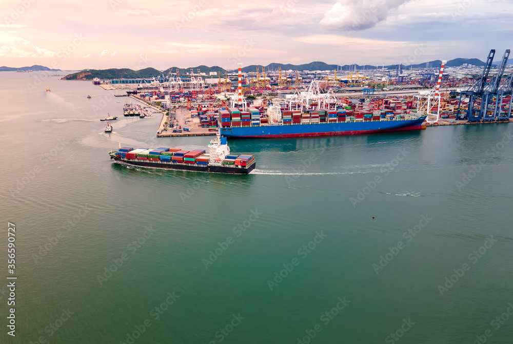Aerial view of Deep water port with cargo ship and container.