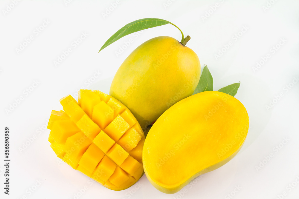 Mango fruit with mango cubes and slices. Isolated on a white background.