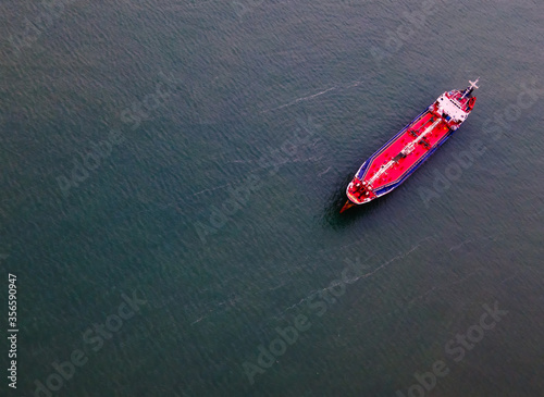 Aerial view tanker ship vessel unloading at port, Business import export oil and gas petrochemical. © Natnan