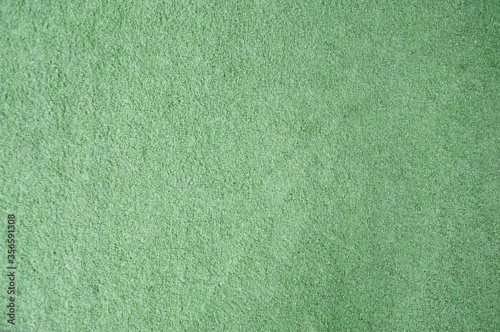 Fototapeta premium Green doormat made of artificial grass