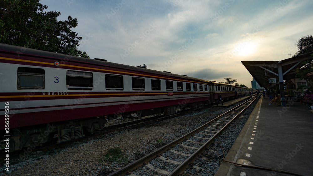 Bangkok, Thailand - April 2, 2019: Perspective of an old train with Undefined passengers waiting for train at train platform