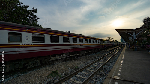 Bangkok, Thailand - April 2, 2019: Perspective of an old train with Undefined passengers waiting for train at train platform