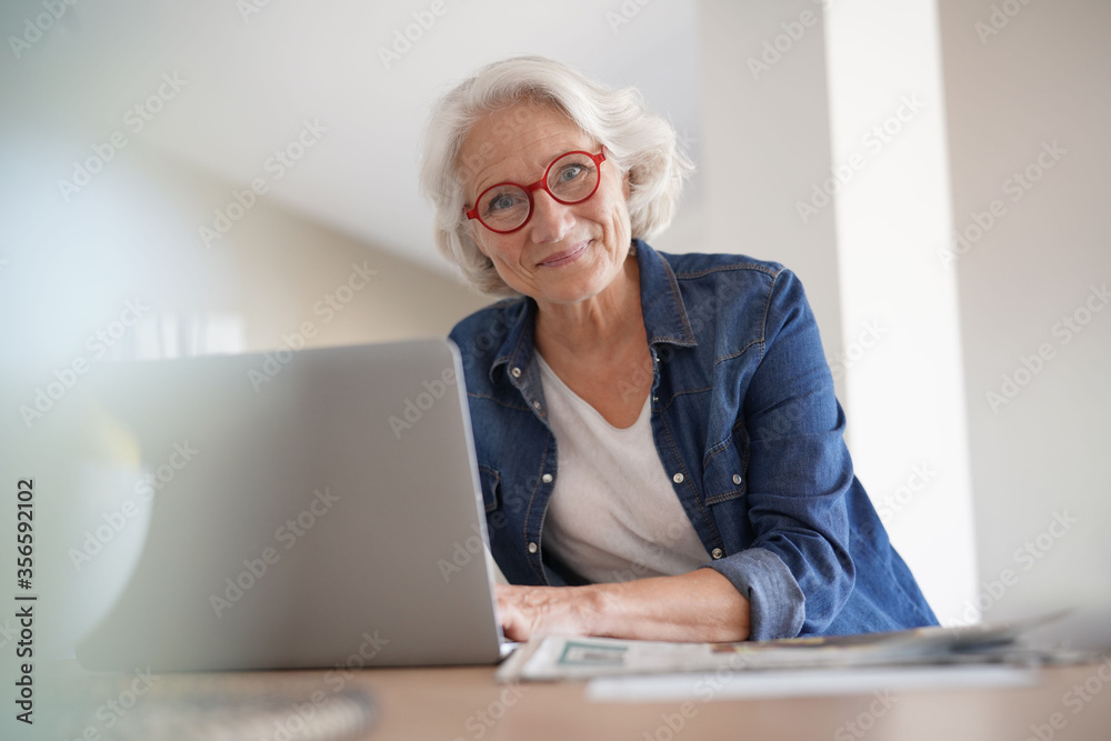 Senior woman using laptop computer at home Senior woman using laptop computer at home